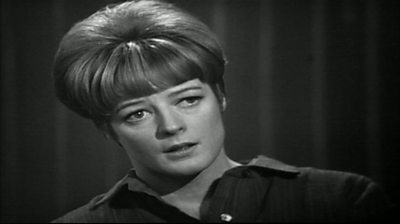 A black and white image of Dame Maggie Smith staring off the camera