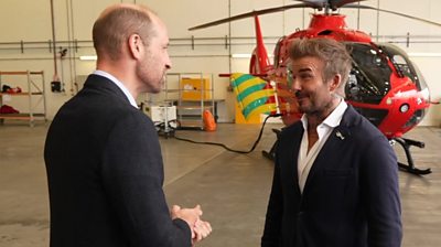 Prince William and David Beckham and helicopter