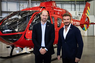 Prince William and DAvid Beckham with helicopter