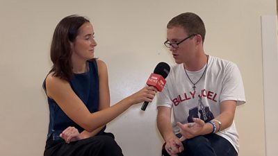 BBC journalist interviewing a college student