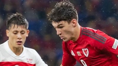 Lewis Koumas of Wales under pressure from Turkey’s Arda Guler during the UEFA Nations League match in Cardiff