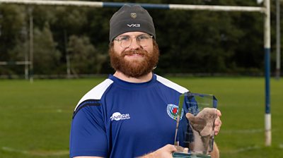 Aaron Wainwright with his player of the year trophy