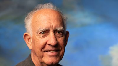 headshot of a man smiling to camera