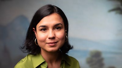 headshot of woman smiling to camera