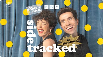 Festive artwork for Sidetracked. Annie Macmanus and Nick Grimshaw are back-to-back in front of a blue curtain. Next to the title of the show, there’s a sparkling, gold sticker reading: “by Christmas.” 