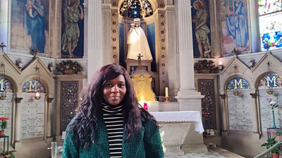 Photo of Presenter Chine McDonald visiting a Black Madonna statue in Orleans, France.