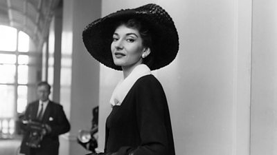 A black and white image of Maria Callas in London on 9 June 1958. She wears a wide brimmed dark hat.