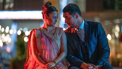 Saima Hyatt (AYSHA KALA) and Harry Virdee (STAZ NAIR) sat together and staring into each others eyes