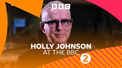 Holly Johnson wears glasses and smiles at the camera