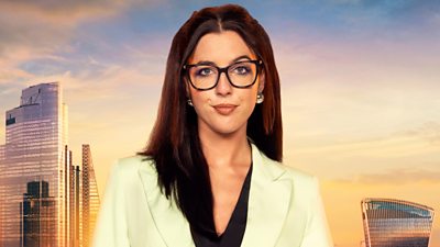 Emma wears a lime green blazer with a black blouse and silver ball earrings. She smiles to camera and wears thick, black-rimmed glasses. A backdrop of the London skyline at sunset 