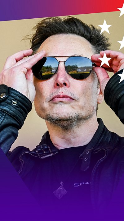 Elon musk wearing a leather jacket and putting aviator sunglasses onto his face