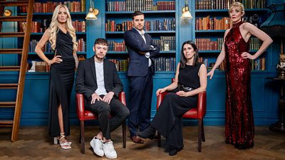 Two men and three women - Leanne, Jake, Alexander, Charlotte and Frankie - sit and stand in the castle library wearing formal dresses and suits
