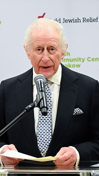 King Charles speaking into a microphone at a Krakow Jewish centre