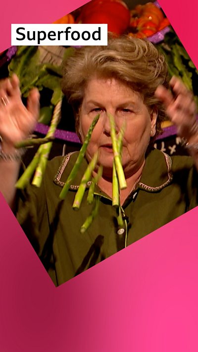 Sandi Toksvig, host of QI, throwing asparagus in the air