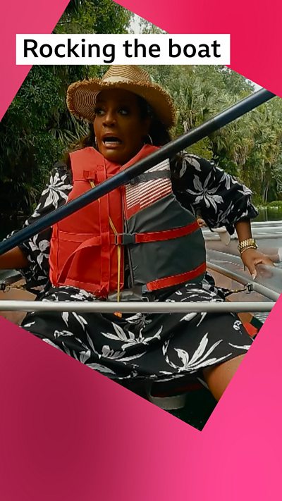 A woman, Alison Hammond, looks panicked in a paddle boat that is tipping to the side