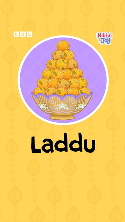 A glistening pile of golden Indian sweets in a dish.