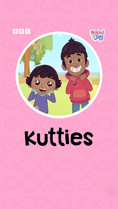 Two south Indian boys with shining eyes hold their hands to their faces, grinning and looking excited.