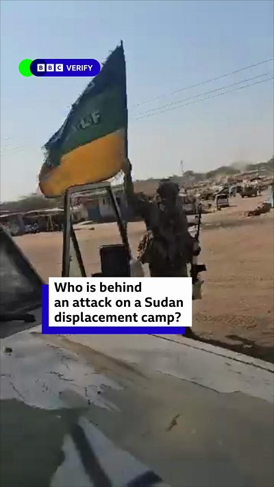 Screengrab of footage from a Sudanese displacement camp, showing soldiers waving an RSF flag