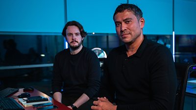 Nick Stapleton and Rav Wilding sit at a desk