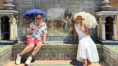 Alan Carr and Amanda Holden on a sunny tiled terrace