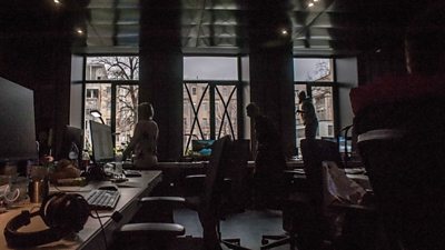 A small team of journalists working in Suspilne (Public) newsroom in Kyiv in 2022