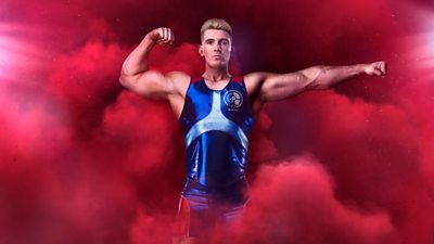 Bionic flexing his muscles in a blue lycra outfit in front of a red background