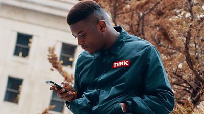 Person using their mobile phone.
