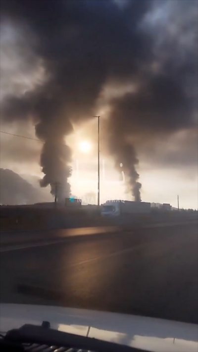 Smoke plumes rise over Kermanshah