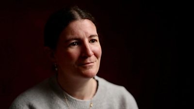 A portrait photograph of Helen Ward against a black background.