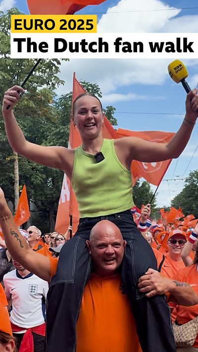 Dutch fans walk to the stadium