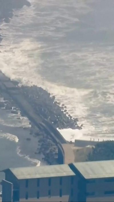 waves crash against Japanese coastline