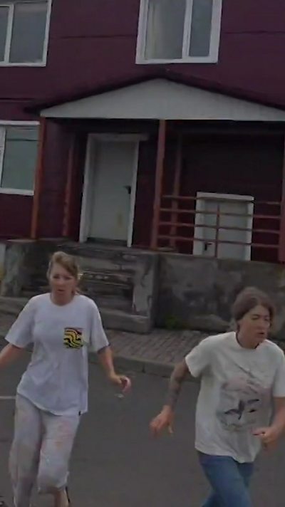 People running from a house