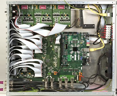 The inside of the Codec - many printed circuit boards and cables.