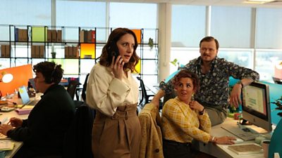 Actors David O'Reilly, Charlotte McCurry, Jamie-Lee O'Donnell and Paul Reid in character in an office setting.