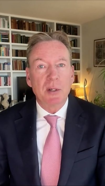 Frank Gardner wearing a shirt and a tie