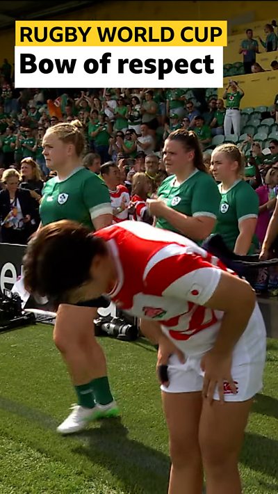Japan player bowing before walking onto the pitch