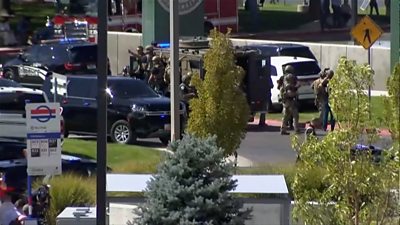 Police vehicle with SWAT team arriving on Utah campus
