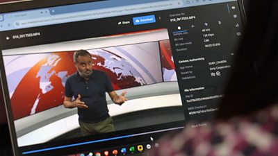 A person is viewing a web browser on a laptop, which is playing the scene shot on the camera earlier, metadata - including information about the content's authenticity is listed down the side of the video in the browser.