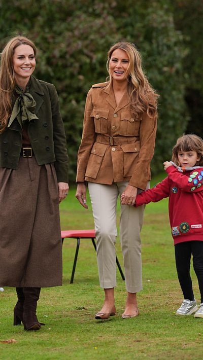 Princess of Wales, Melania Trump and a scout walk together