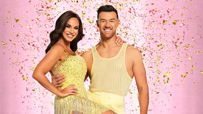 Vicky wears a sparkling yellow bejewelled dress while Kai wears a glittering yellow tank top and yellow trousers.