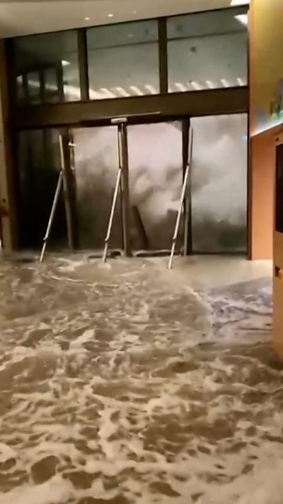 Water blasts through hotel doors