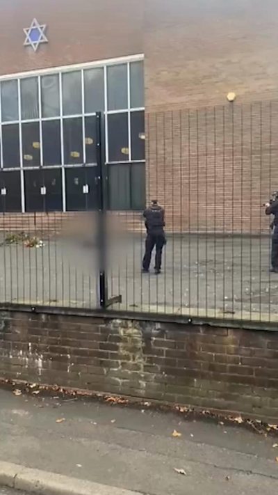 Two officers seen at the scene in Manchester