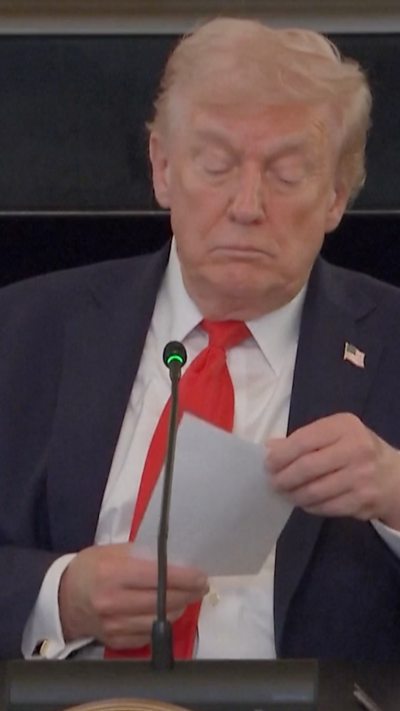 Trump reading note on paper