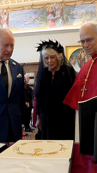 King Charles, Queen Camila and Pope Leo look at golden gift