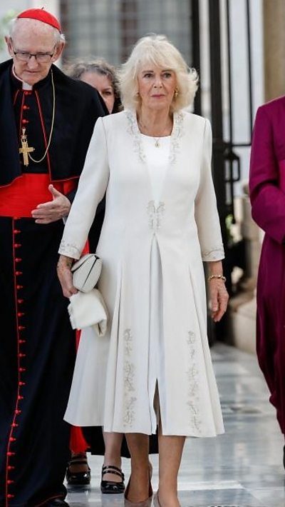 Queen wearing a white dress