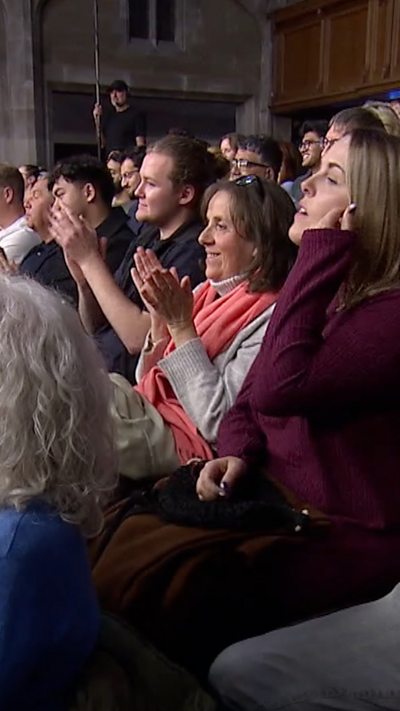 Audience members applauding
