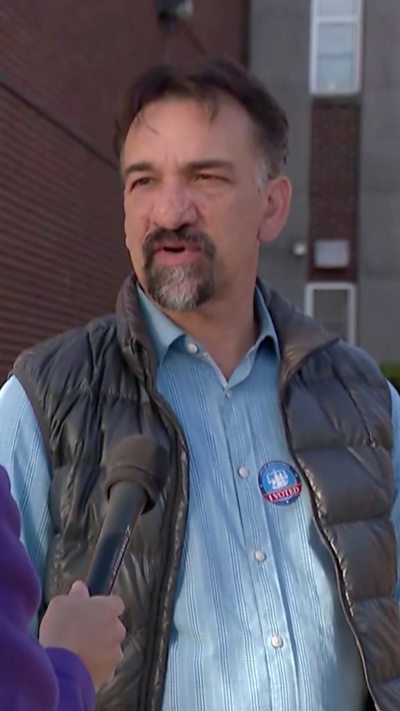Virginia voter is talking to the news after voting.