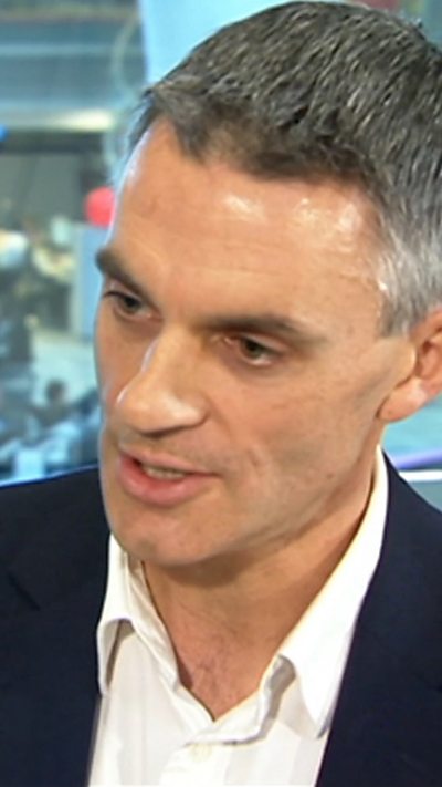 Tim Davies wearing a suit as a younger man