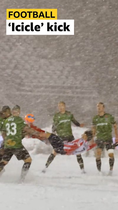 Atletico Ottawa player David Rodríguez scoring a bicycle kick in the snow.