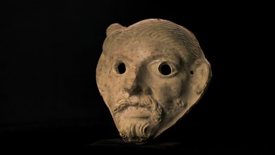 A stone mask of a bearded man that represented an Ancient Rome theatre mask 